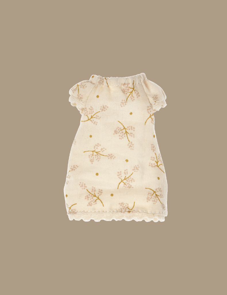 Maileg Extra Clothing: Nightgown For Big Sister Mouse is cream-colored with delicate floral patterns in light brown and yellow, perfect for a pyjamas party. The nightgown features short sleeves, a gathered neckline, and scalloped hems at the bottom. The background is a soft beige tone.