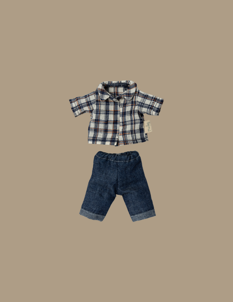Elevate your mouse collection with the Maileg Extra Clothing: Clothes For Dad Mouse, featuring a delightful outfit that includes a blue, white, and red plaid shirt adorned with short sleeves and buttons. Paired perfectly with dark blue denim jeans complete with stylishly folded cuffs, this charming clothing set is artfully displayed on a plain beige background.
