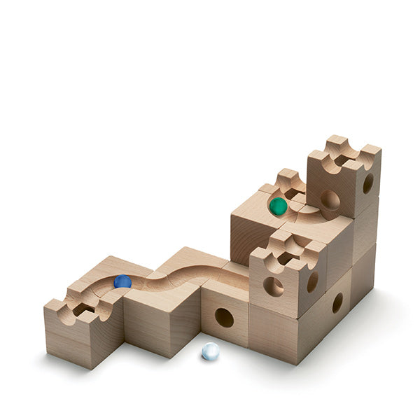 A Cuboro Tunnel Marble Run Extra Set featuring wavy paths and holes, with three marbles (green, blue, and white) positioned within the structure of a Cuboro marble run, against a white background.