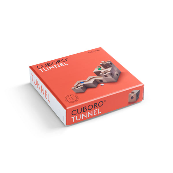 A package of Cuboro Tunnel Marble Run Extra Set, a wooden track system, featuring an illustration of the tunnel tracks on a vibrant orange background. The product label includes "Cuboro Tunnel Marble Run Extra Set" and the brand.