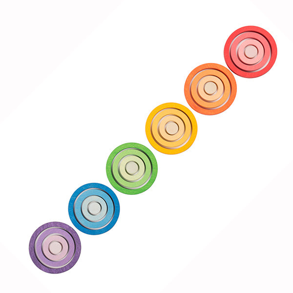 Colorful, lined-up Grapat Nesting Rings in a diagonal arrangement on a white background, showcasing a rainbow spectrum from red to purple.
