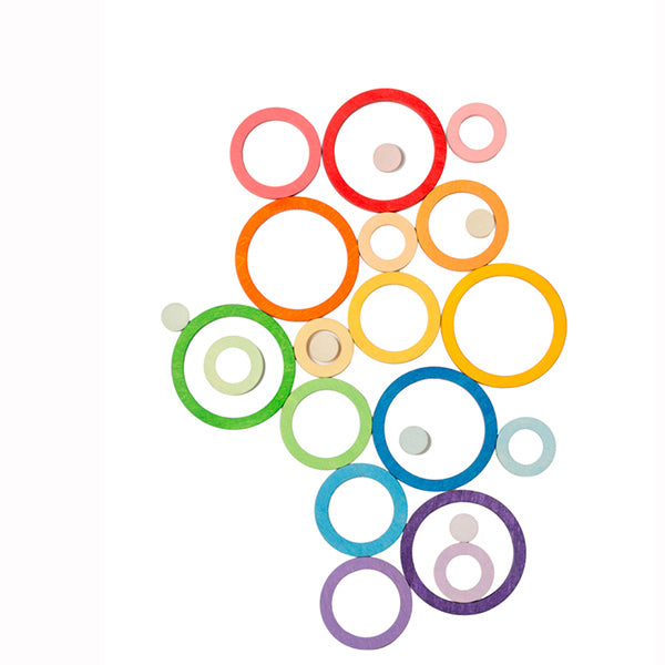 Sentence with product name: Grapat Nesting Rings in various sizes, colors, and transparency levels arranged in an abstract tree-like structure on a white background.