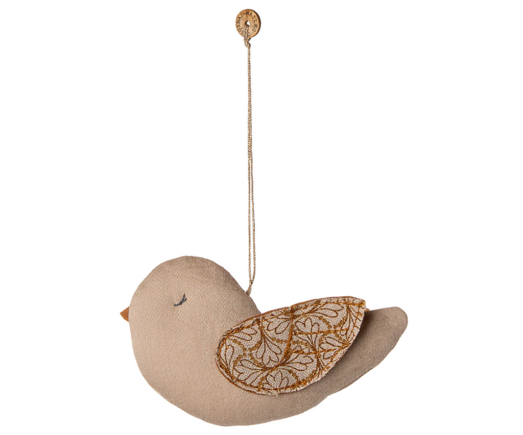 The Maileg Fabric Ornament, Bird - Winter Heart - Sand is a soft beige fabric bird with embroidered wings, hanging from a string and button, shown on a white background.
