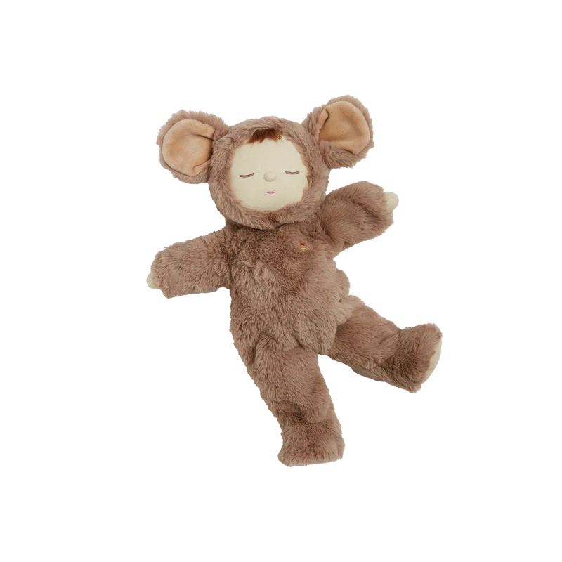 The Olli Ella Cozy Dinkum - Mousy Pickle is a soft plush doll in a brown fuzzy costume with round ears, closed eyes, and a peaceful expression—resembling a cozy animal suit. The doll is shown lying on a white background.