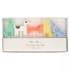 A box containing five quirky Meri Meri Dog Candles shaped like different dogs in pastel colors, with the label "meri meri 5 birthday candles" in elegant font.