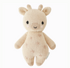 A hand-knit beige Cuddle + Kind Baby Giraffe stuffed toy designed to look like a giraffe with subtle textures and black embroidered eyes, isolated on a white background.
