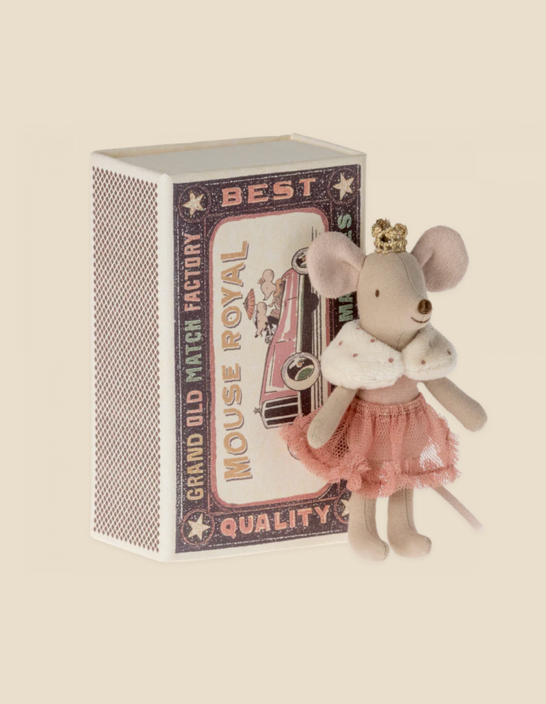 A charming Maileg Princess Little Sister mouse dressed in a pink tutu and gold crown, standing next to a decorative matchbox labeled "best mouse royal" on a light beige background.