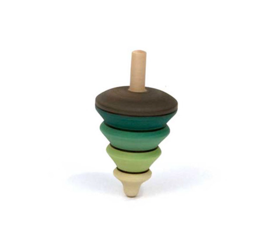 The Mader Spinning Tree Top On Trunk is a maple wood top with tiered, bulbous sections in brown, green, and light yellow. It stands upright on a white background and meets toy safety standards.