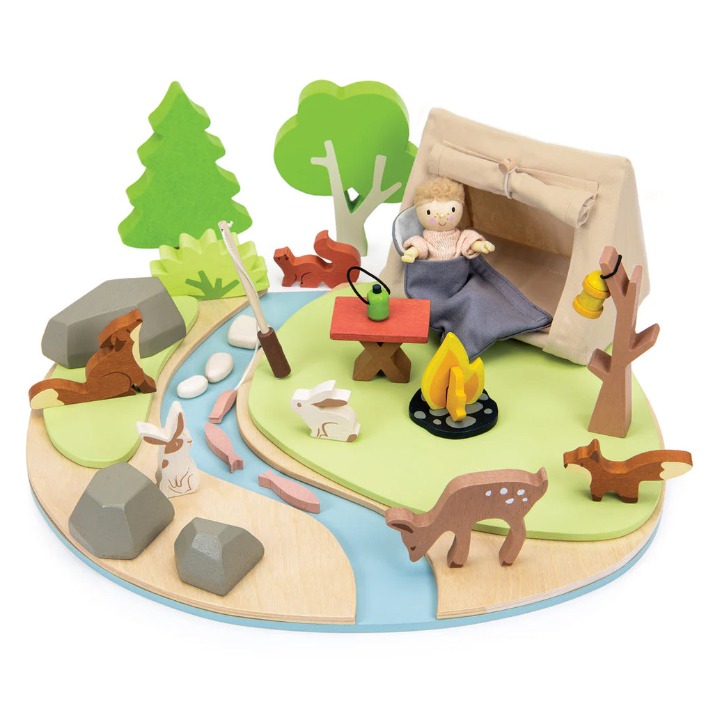 The Wildlife Camping Playset creates an imaginative campsite with a tent, hiker, and campfire. Includes detailed elements like a teapot on a table, trees, deer, rabbits, and a stream with rocks and bushes on a circular base for storytelling. Perfect for imaginative play adventures.