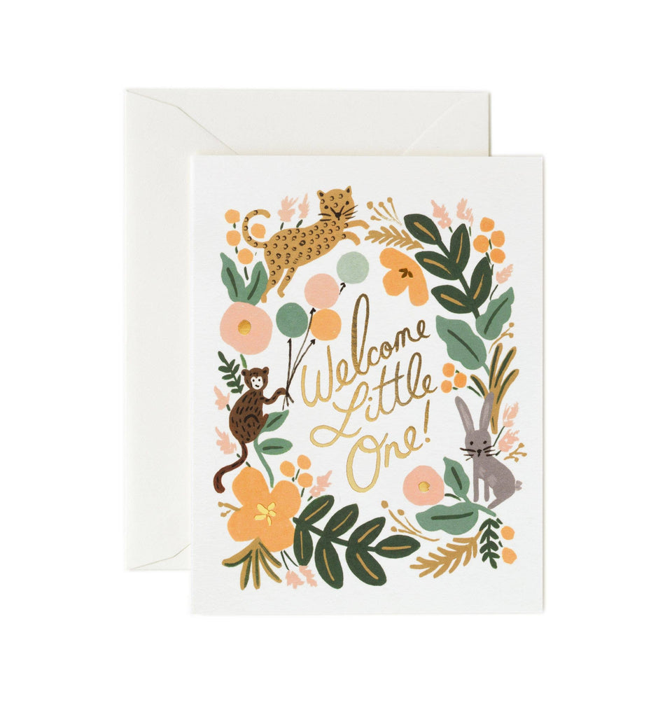 The Menagerie Baby Card features illustrated flowers, leaves, a cheetah, monkey, and giraffe around metallic gold foil "Welcome Little One!" text. It comes with a white envelope and has a blank interior for your personal message.