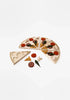 A Sabo Concept Wooden Pizza toy playset with various toppings scattered on a white background; the pizza is divided into sections, one of which is separate from the rest.