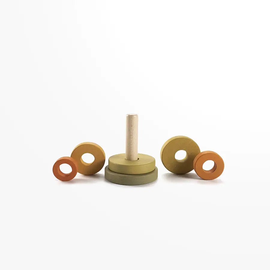 Product Data: Mini Wooden Pyramid Stacker - Jungle
A minimalist Mini Wooden Pyramid Stacker - Jungle from Sabo Concept, handmade with non-toxic paint, features a central peg and five rings in varying sizes and colors such as green and orange. Against a plain white background, three rings rest beside the base while two are stacked.