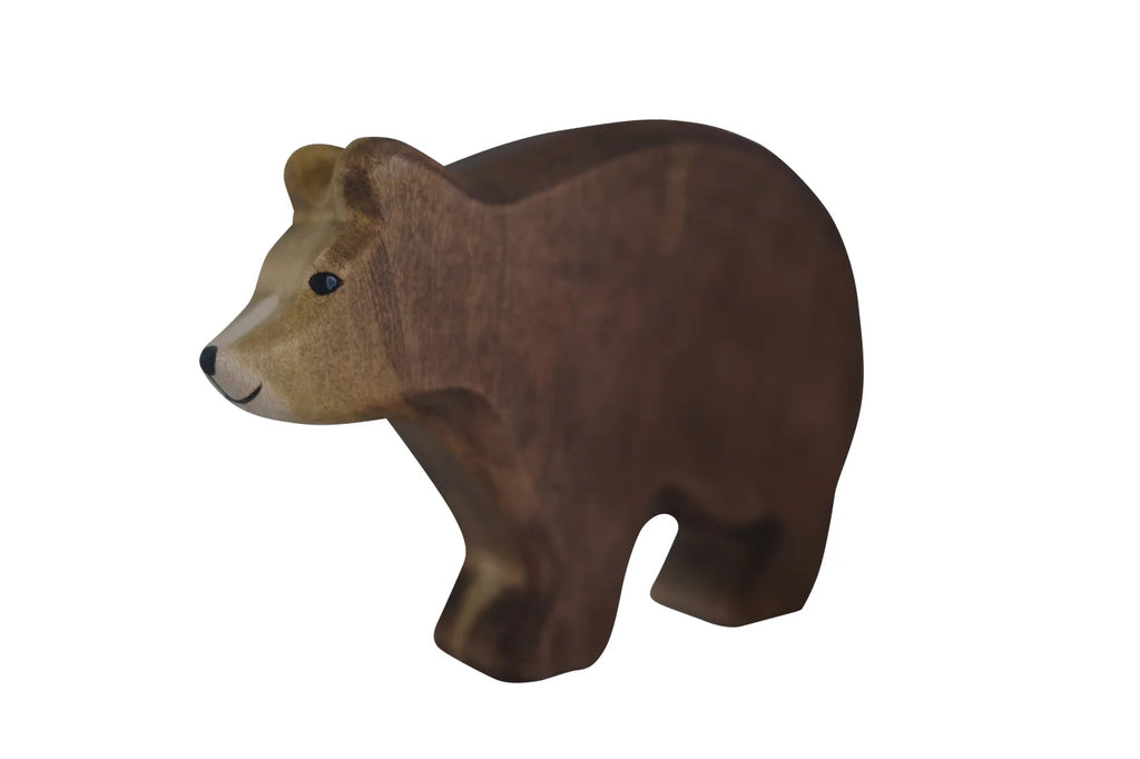 A Handmade Holzwald Bear figurine with a smooth finish and realistic features, colored with natural dyes, isolated on a white background.