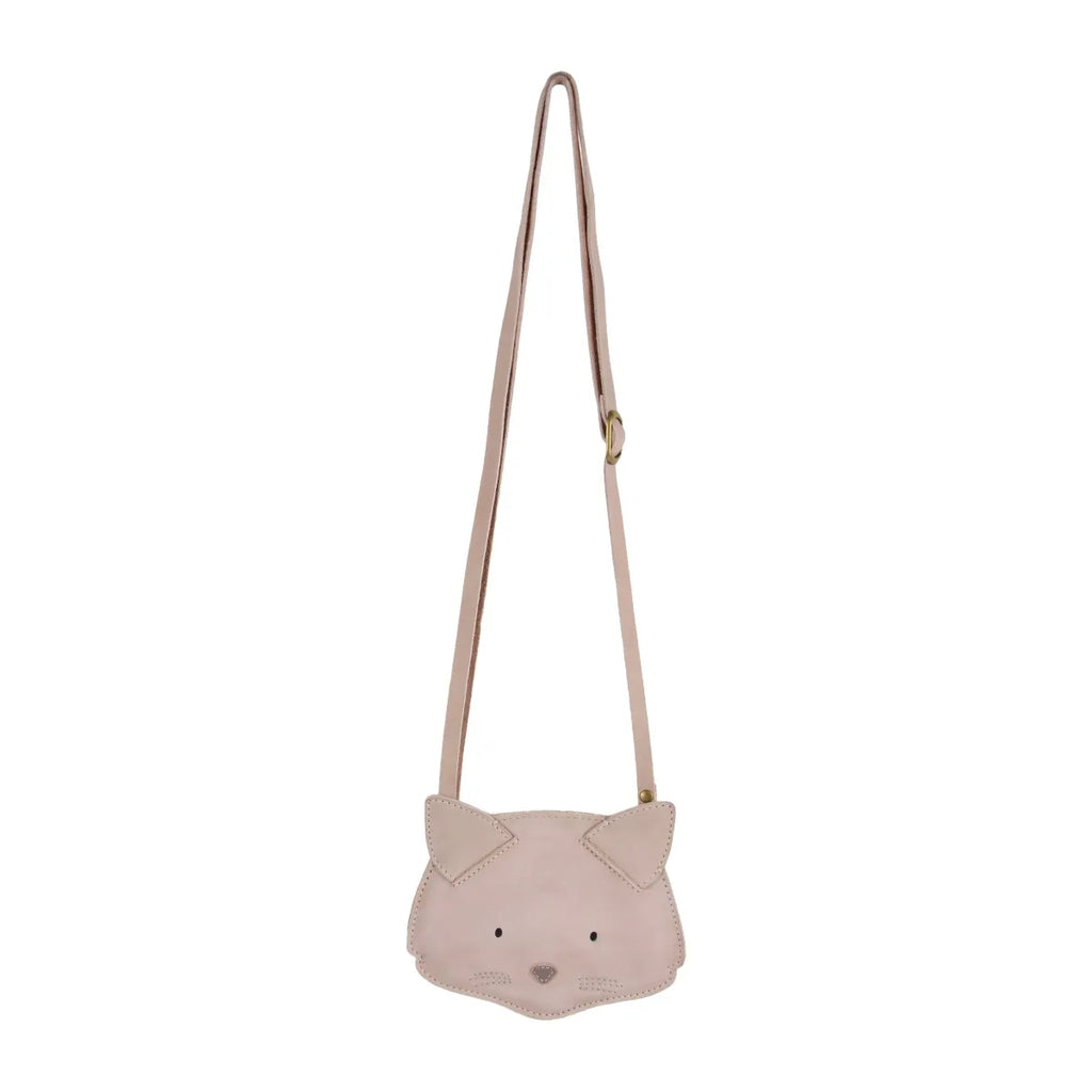 A light pink, Donsje Britta Classic Purse - Cat-shaped children's cross-body bag with pointed ears and subtle facial features, hanging from a slim strap against a white background.