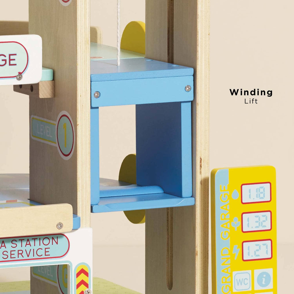 A close-up of the Le Grand Wooden Garage highlights its blue and yellow "Winding Lift," garage signs, and "LEVEL 1" markings—making it ideal for imaginative and educational play.