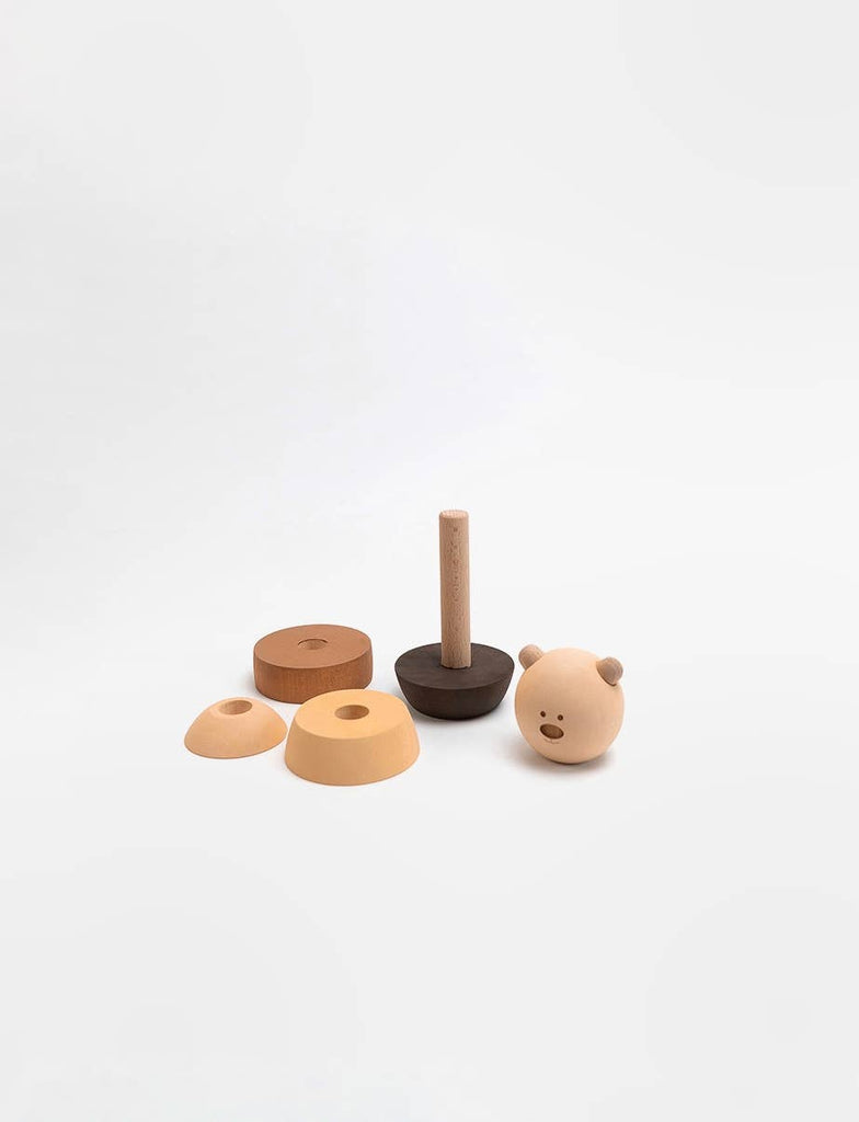 The Sabo Concept Bear Stacker - Beige is a wooden toy with several circular and semi-circular natural-toned pieces and a bear-shaped head, all displayed on a plain white background.