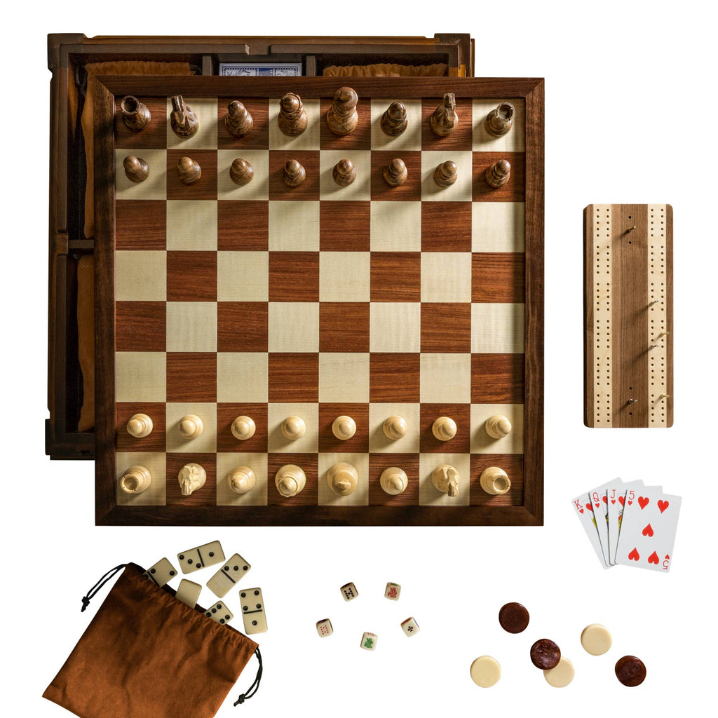 A top-down view of a wooden chessboard set for play, part of the Heirloom Edition: 7-in-1 (Chess, Checkers, Backgammon, Cribbage, Poker Dice, Cards & Dominoes), featuring a walnut cabinet and storage for all included classic games.