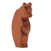 A Ostheimer Large Bear - Standing Head Low, intricately carved from a single piece of wood, with visible grain and a smooth finish. The bear is posed upright, looking slightly to the side.