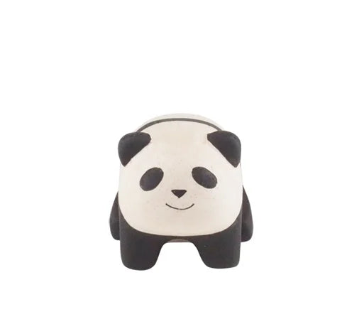 The Handmade Tiny Wooden Panda Child is a small, cute figurine with a rounded body, black ears and legs, and a smiling face, handcrafted by Bali artisans from Albizia wood. Shown front-facing against a plain white background.