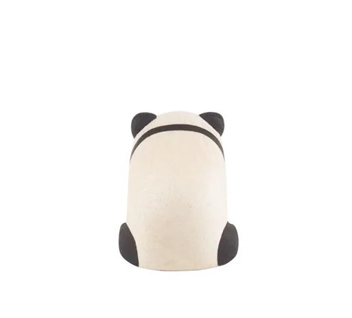 The Handmade Tiny Wooden Panda Child is a minimalist sculpture, handcrafted by Bali artisans from Albizia wood, featuring a rounded white body with black ears, arms, and a black back stripe against a plain white background.
