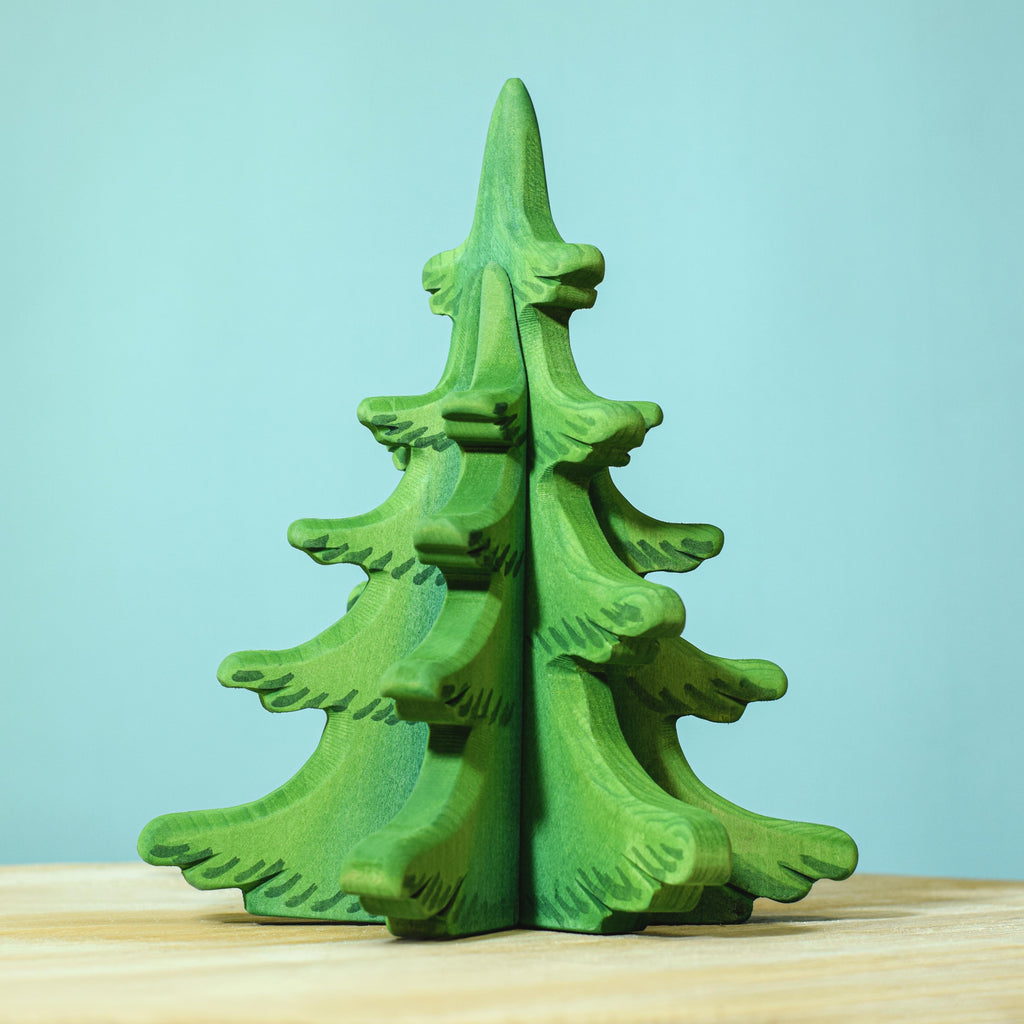 A Extra Large Wooden Sugar Pine Tree figurine with intricate detailing, crafted from sugar pine, standing on a wooden surface against a soft blue background.