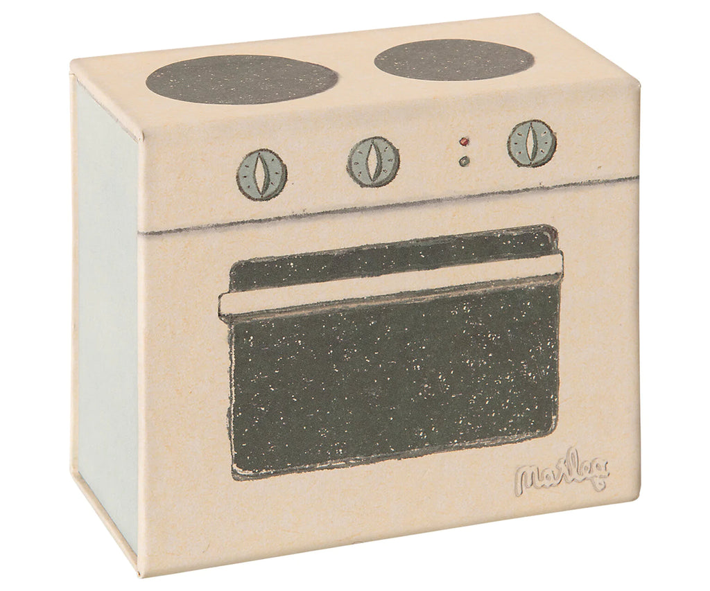 A playful Maileg Cooking Set box, vintage-style oven made of wood with a distressed cream finish. It features two stovetop burners and an oven door depicted in simple black and gray illustrations.