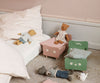 A child's room with a Wooden Bed for Teddy Dad - Dusty Green and mini furniture including chairs and a dresser, hosting stuffed animal toys such as bears and a mouse, arranged in a playful scene.