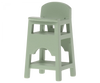 A light green Maileg Mouse Size wooden high chair with back support and footrests, isolated on a gray background.