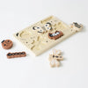Wooden tray puzzle board with animal-shaped pieces including a fox, zebra, and panda, on a plain white background. The puzzle pieces are partially out of their slots.
Product Name: Wooden Tray Puzzle - Bugs