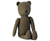 A Maileg Teddy Dad with a minimalist design is sitting upright. The bear has simple black eyes, a small nose, and no visible clothing or accessories. Its soft linen fabric appears to be textured, giving it a rustic and vintage look.