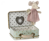 A Maileg Angel Mouse in Metal Suitcase dressed in a pink dress sits on the edge of an open, mint-coloured suitcase adorned with star patterns. The inside of the suitcase features the text "Maileg" within a heart-shaped design.