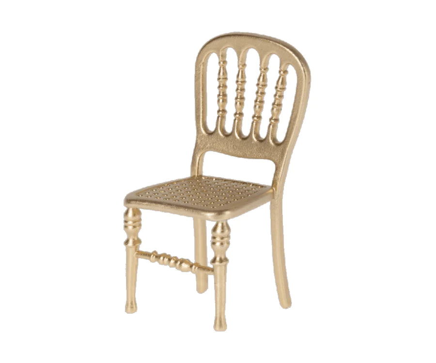 Metal gold chair. White background.