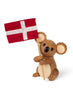 A Spring Copenhagen Matilda toy holding a flag with a red background and a white cross, standing upright against a white background, crafted from FSC Oak.