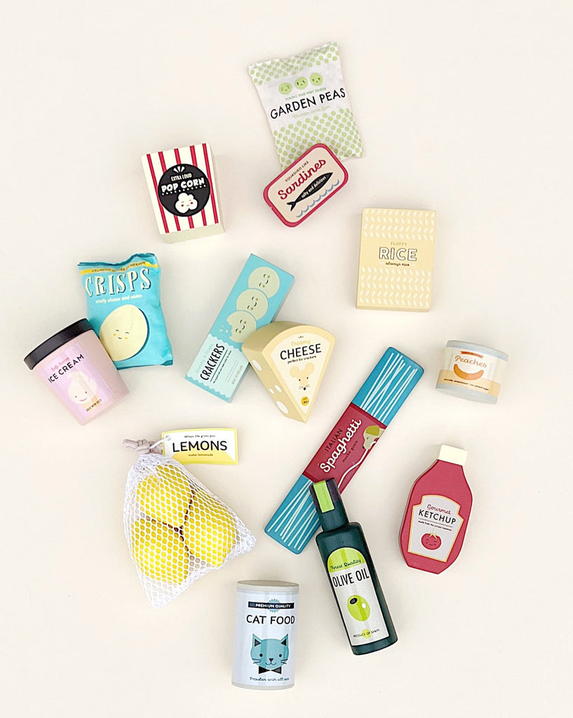 Assorted miniature food and Grocery Set neatly arranged against a white background, including crisps, cheese, lemons, and cat food, all depicted with cute animated designs as part of a toddler kitchen accessories