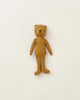 A Maileg Teddy Mum with a vintage look, simple features, and thin limbs stands upright against a plain white background.