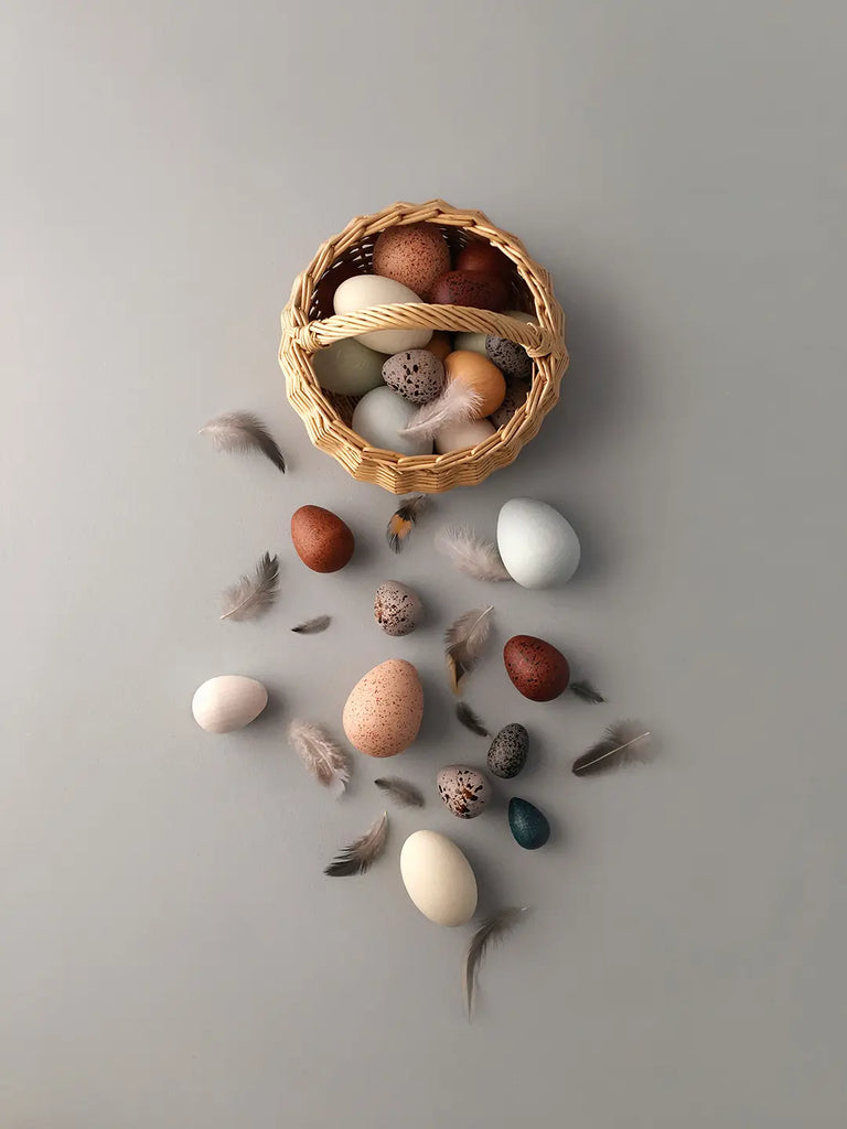 wooden egg toys in a basket