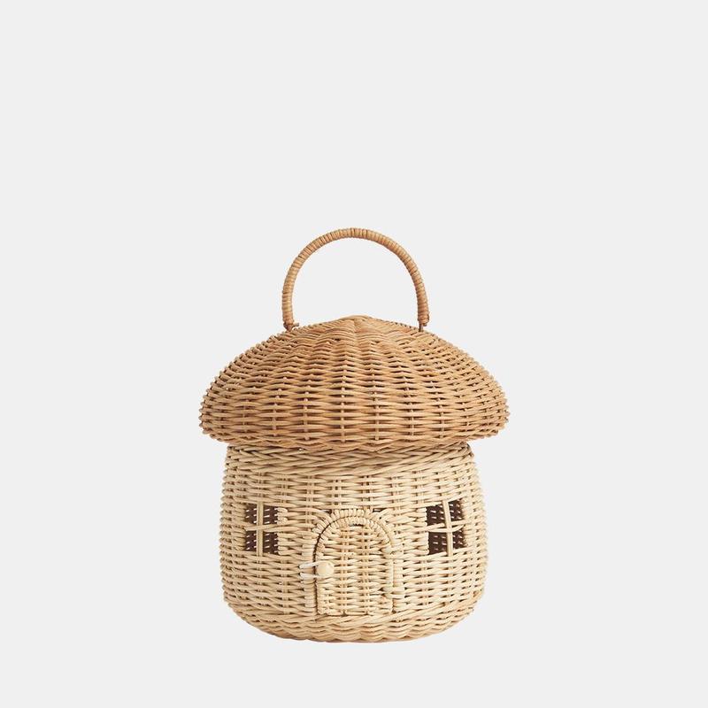 A natural rattan mushroom basket with a white background. Two windows and door.