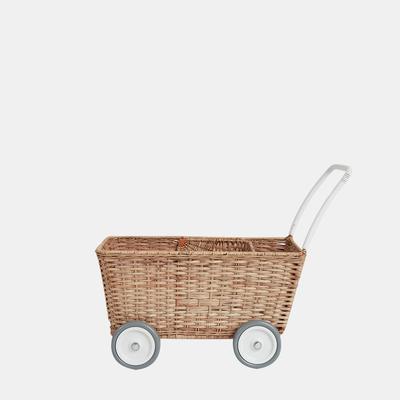 A hand-woven Olli Ella Rattan Doll Stroller on wheels with a white handle, isolated on a plain light background.