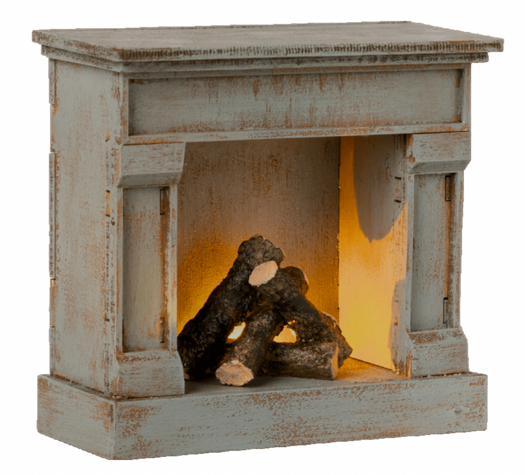 Off white fireplace with wood.