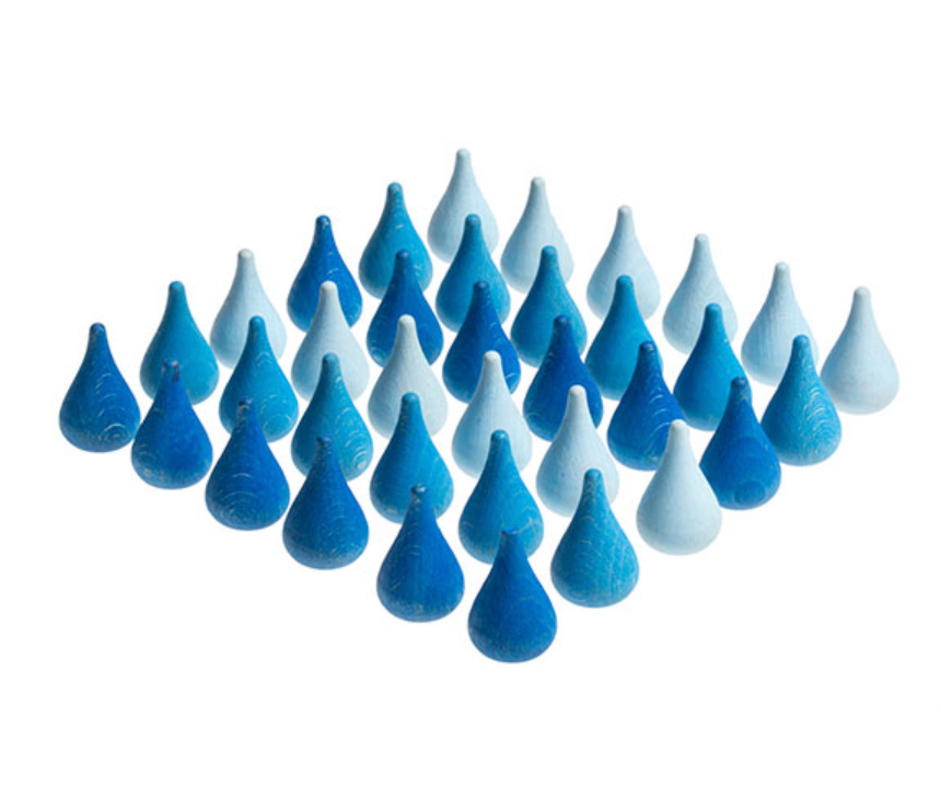 An arrangement of Grapat Mandala Raindrops in varying shades and sizes, displayed in a triangular formation with non-toxic finishes on a white background.