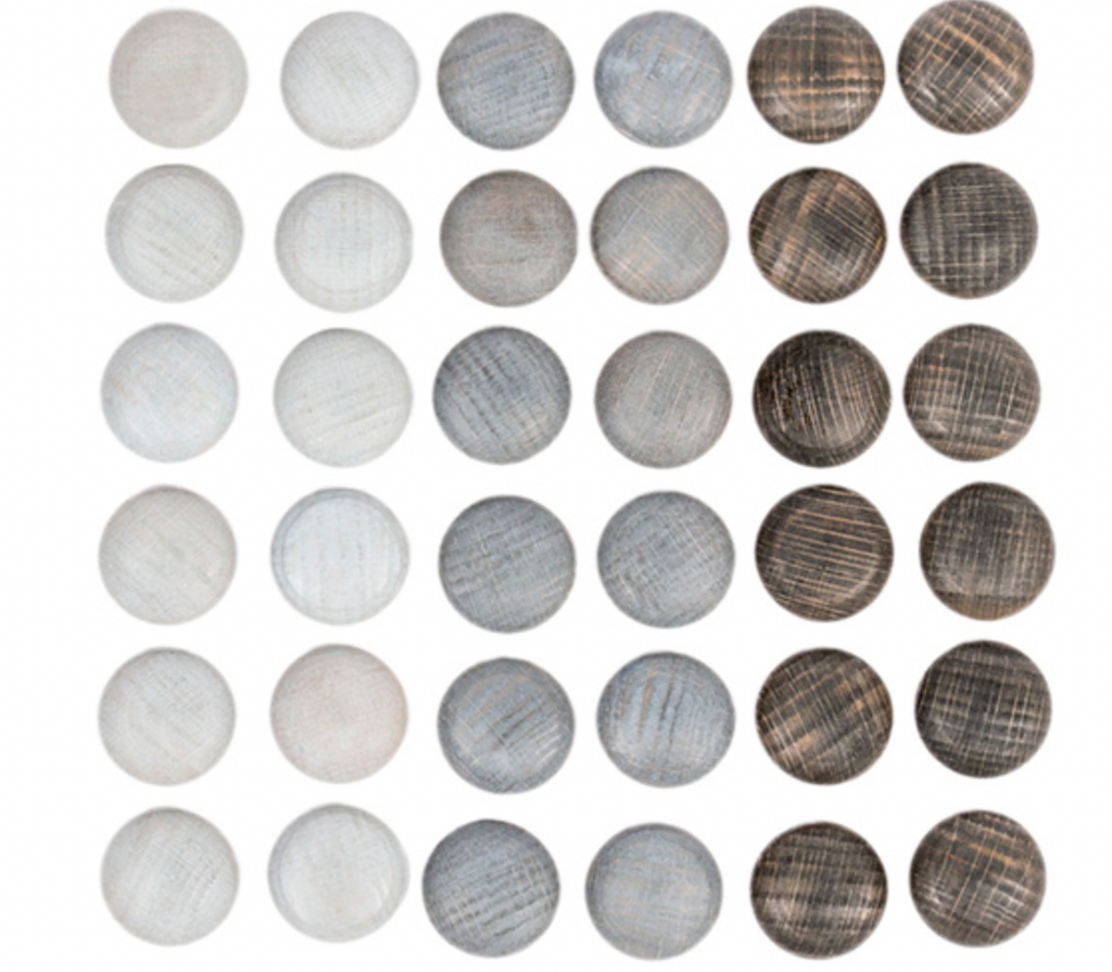 Grid of 36 Grapat Mandala Stones displayed in different shades and patterns of gray and white, inspired by the sustainable aesthetics of Grapat toys.