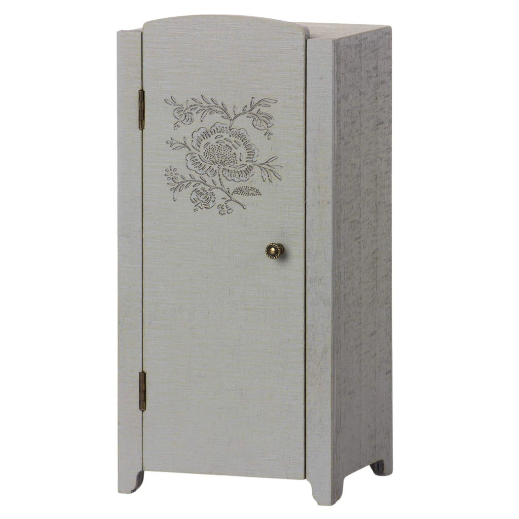 A tall, narrow, light gray Maileg Miniature Closet with printed details on the door and a round knob, standing against a white background.