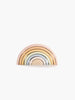 A Handmade Rainbow Stacker - Pastel composed of arches in soft pastel colors ranging from pink to beige, neatly arranged against a white background.