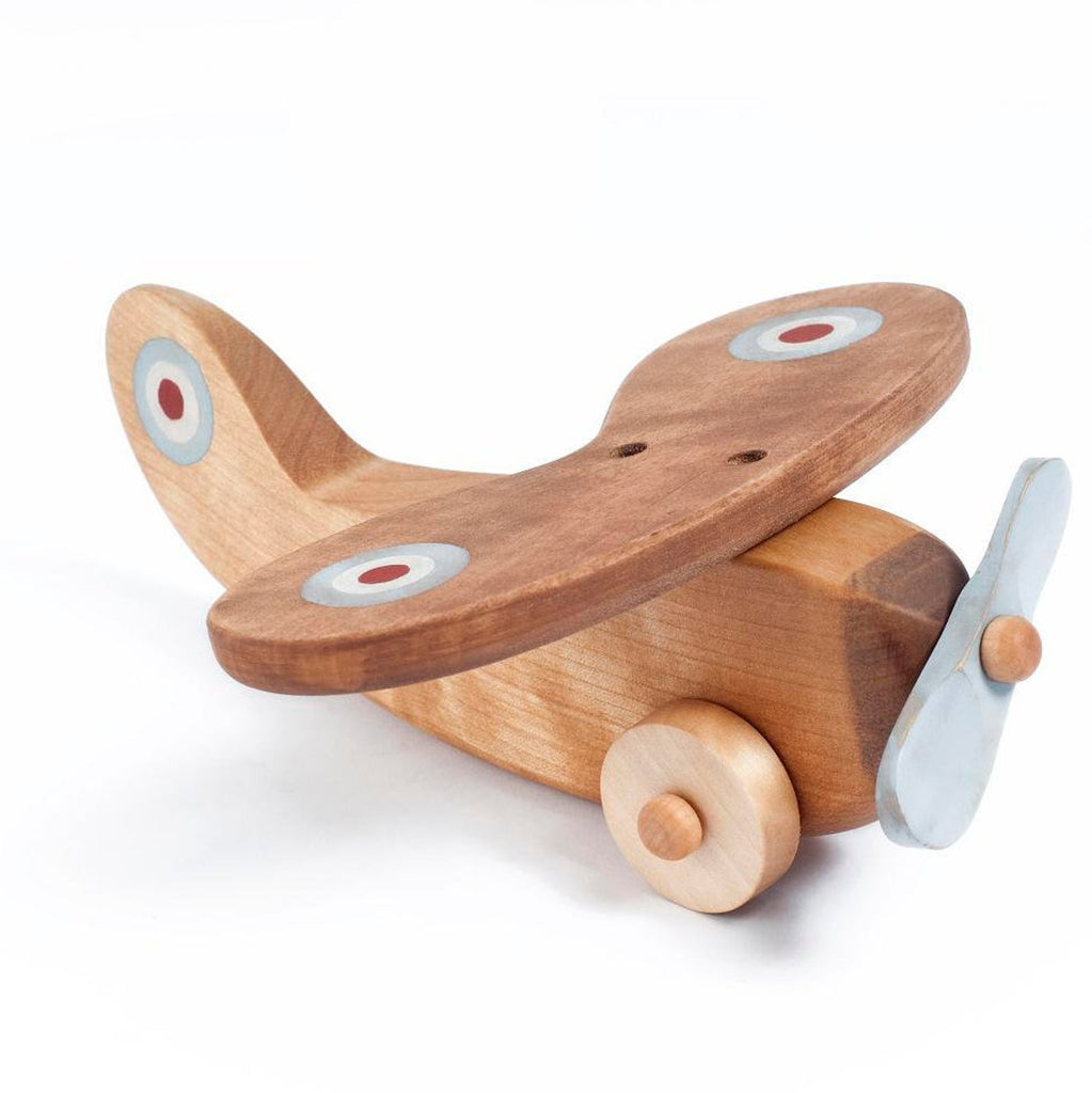 Wooden airplane with light blue propeller. White background.
