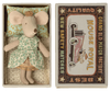 Maileg Princess Little Sister Mouse dressed in a green floral patterned attire and golden tiara, lying in a decorated matchbox that reads "grand old mouse royal match factory" with a vintage car design.