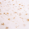 Meri Meri White Tulle Star Cape Costume adorned with scattered gold glitter stars, both small and large, on a neutral background.