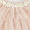 Close-up of a Meri Meri Peach Tulle Bunny Costume adorned with a row of white daisy appliques along the top edge, creating a delicate and feminine texture.