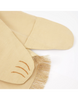 A close-up image of a pair of yellow ballet shoes with a fringed cloth, part of the Meri Meri Lion Costume - Final Sale, detailed with delicate brown stitching resembling three curved lines on the side.