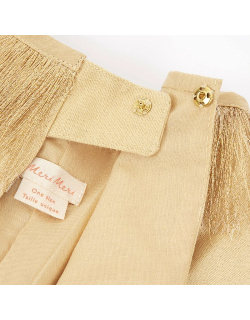 Close-up of a beige Meri Meri Lion Costume ages 3-6 with a "mert & marcus" label, featuring tassel details and gold buttons on a structured collar.