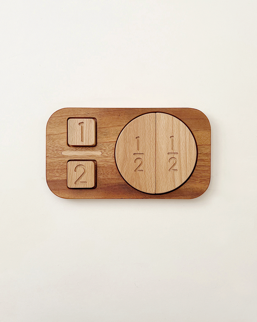 The Wooden Fraction Puzzle - Made in USA features two square blocks labeled "1" and "2," and a circle split into halves marked "1/2," all on a rectangular wooden base—an ideal visual learning tool for preschoolers.